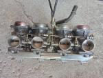 Klikněte pro detailní foto č. 11 - Karburátory-alternátor-motor-rám-startér CB 750